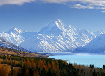 38773AM00: Aoraki / Mount Cook (3754m) and Lake Pukaki in winter. Mt La Perouse (3078m) left, Tasman Valley and Burnett Mountains Range right. Panorama with late autumn colours, Aoraki / Mount Cook National Park, MacKenzie District, New Zealand. Photocred